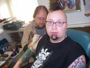duringthejestertattoocoverupforrightarm.jpg