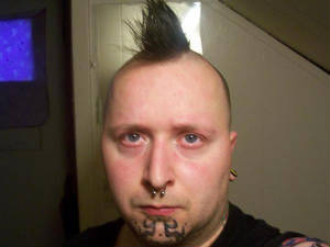 facecloseupwithnewjesterchintattoo.jpg